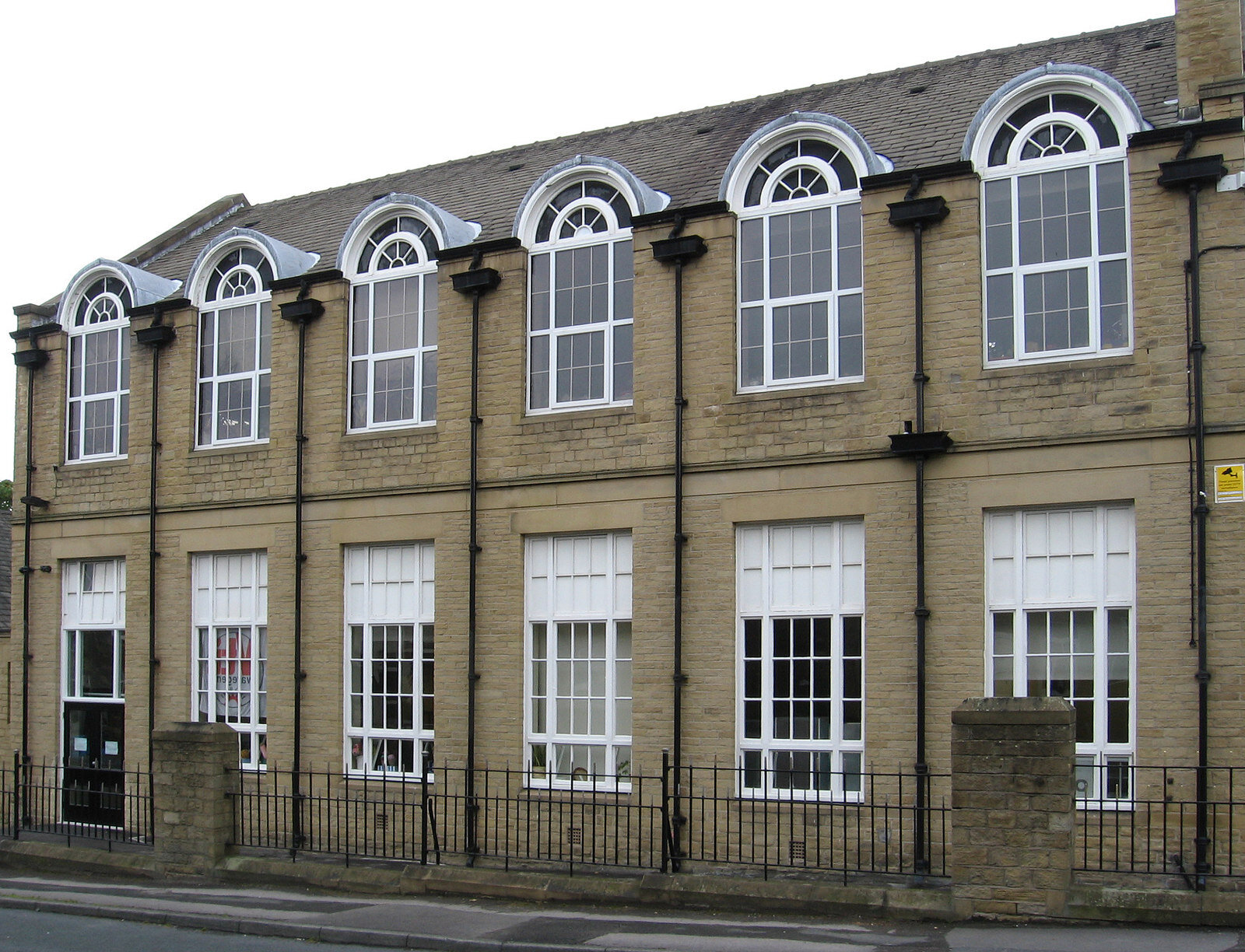 The tall arched windows of the Victorian grammar school building at Heckmondwike in West Yorkshire